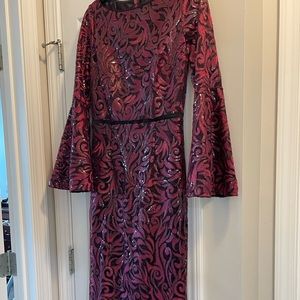 Long, formal dress with red and black sequences Carmen Marc Valo